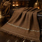 Lamb Wool Shawl in rich brown with a soft texture and decorative silver thread detail along the border, featuring fringed edges