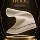 Majestic Wool Shawl in soft, off-white wool with a delicate black and gold border, showcasing elegant drape and premium texture