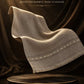 Majestic Wool Shawl in soft taupe wool with subtle decorative border, featuring rich texture and elegant drape
